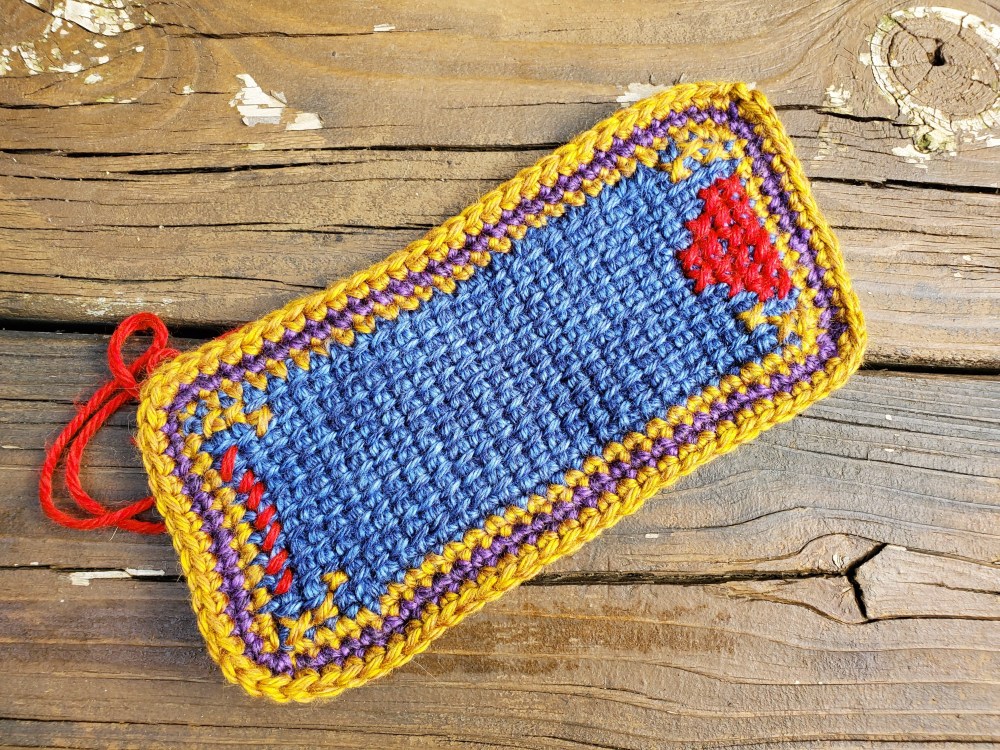 Cross-stitch tunisian crochet mug rug in progress