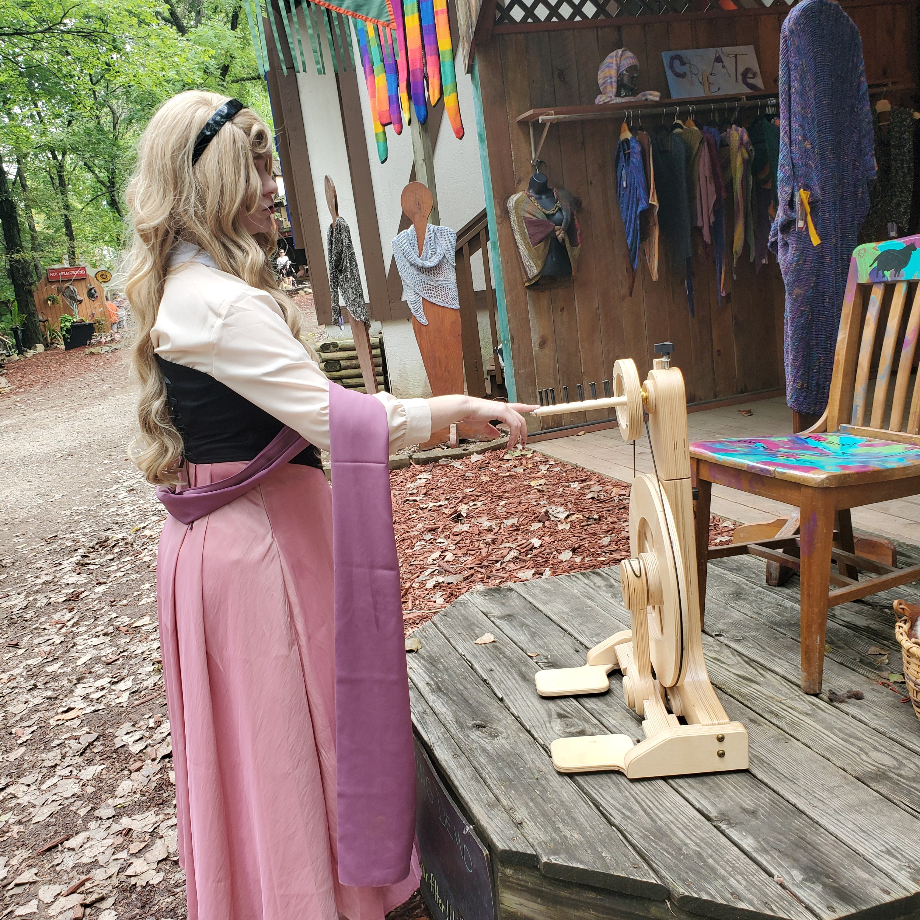 Sleeping Beauty pricking her finger on the spinning wheel