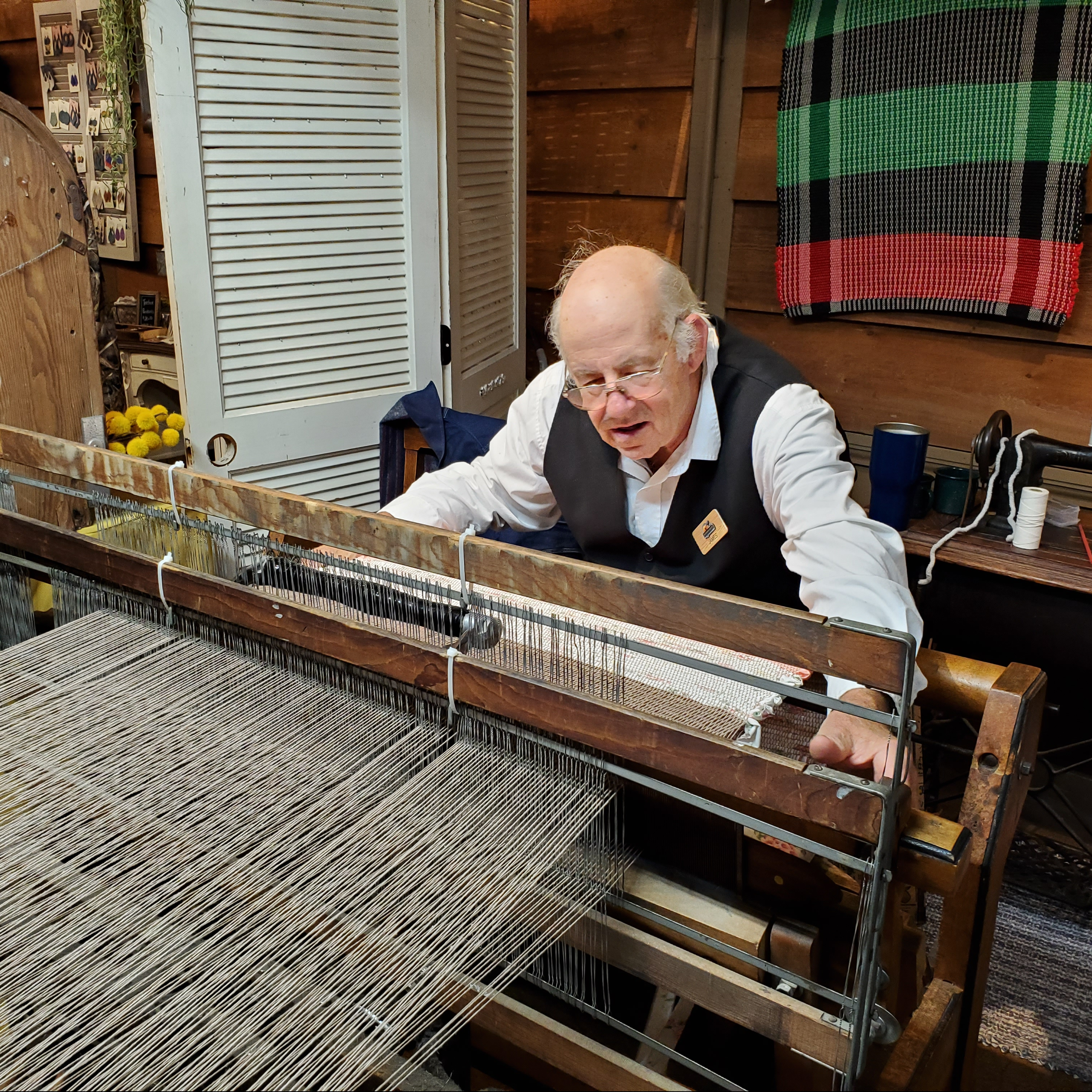 Mr. Taylor weaving on his loom
