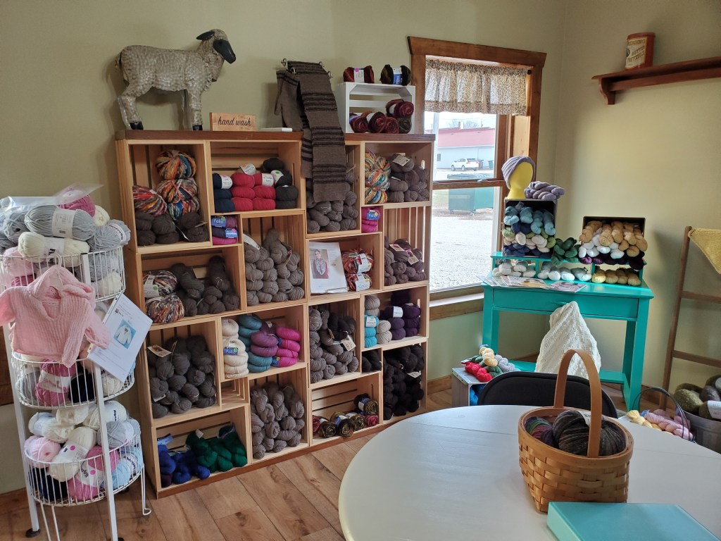 Wall of yarn in the Snips of Thread quilt shop