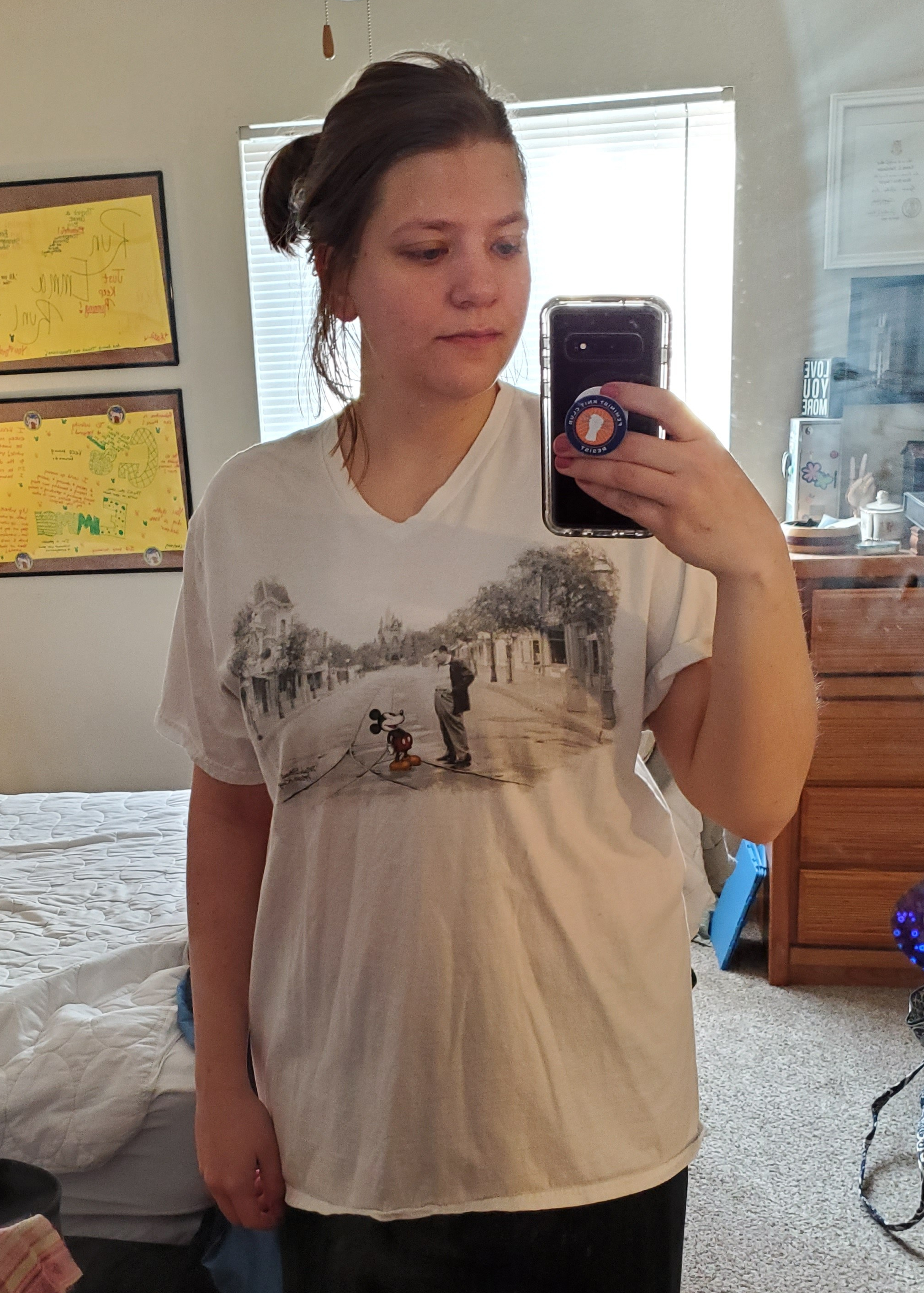 Emma in a long Mickey Mouse tee