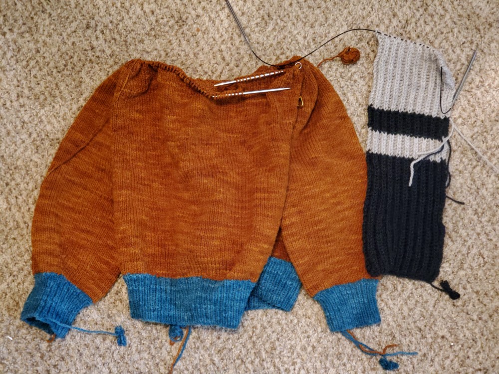 2/3 of a sweater and 1/3 of a scarf
