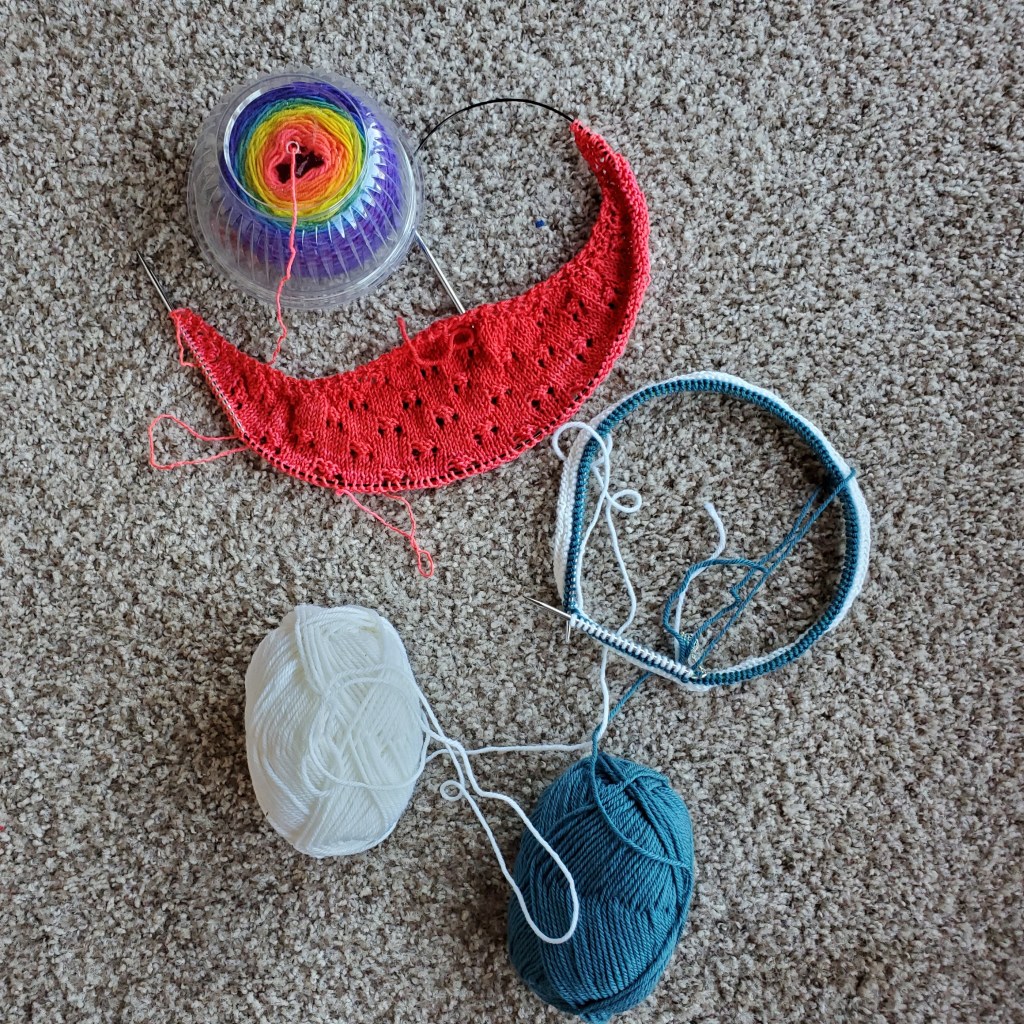 In-progress rainbow shawl and blue and white cowl