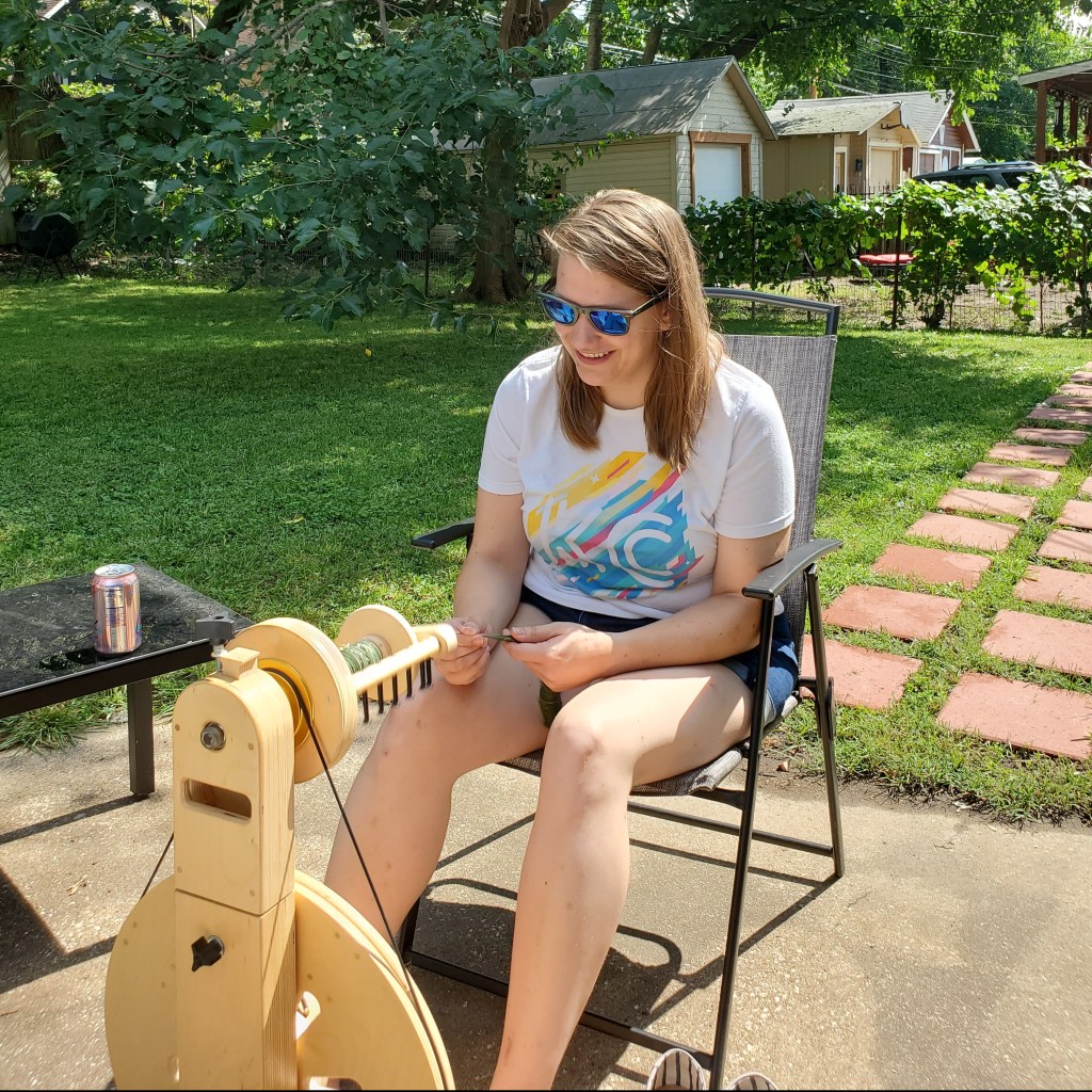 Emma spinning on a concrete patio