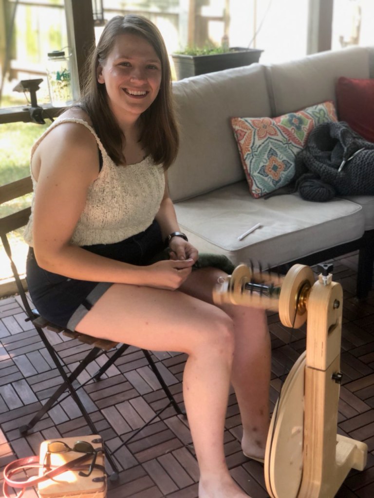 Emma spinning on a wood deck