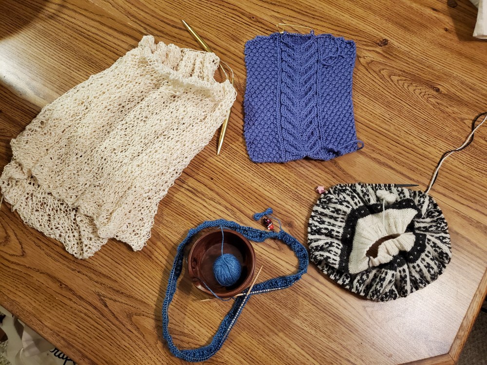 Four in-progress projects, laid out on a table