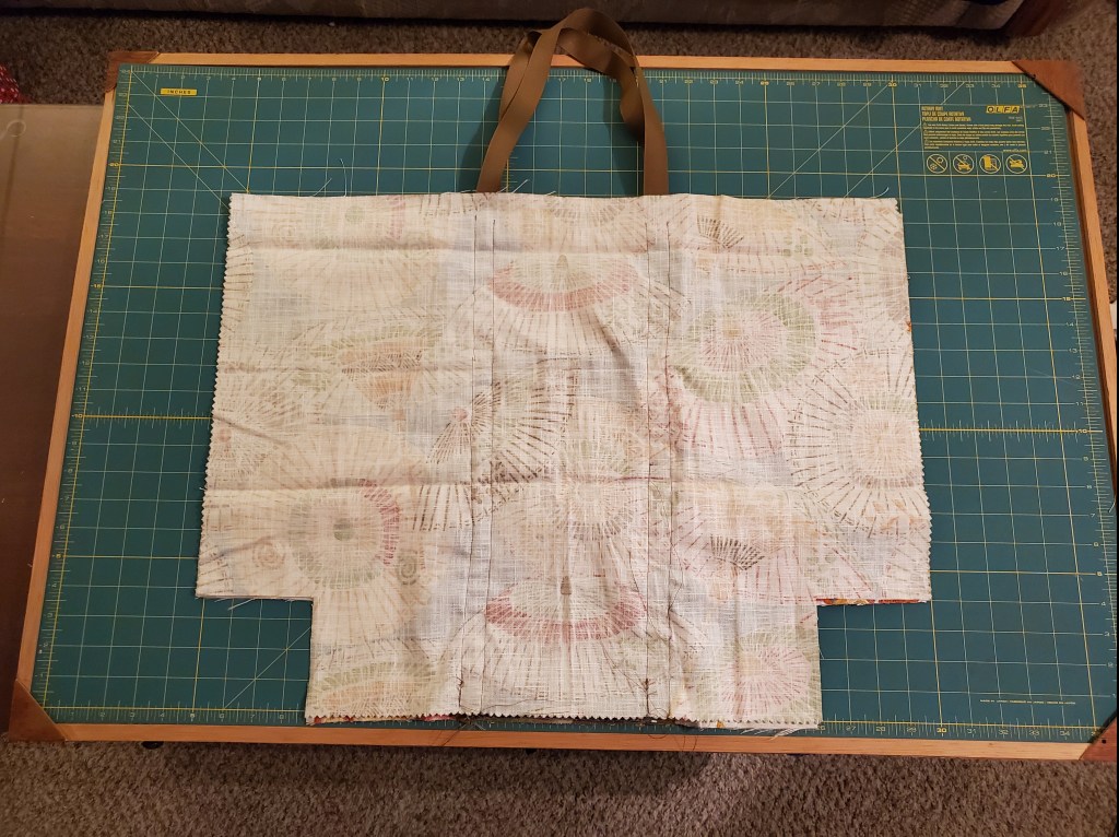 One side of the bag, wrong side out, seamed