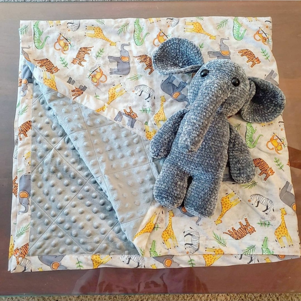 Baby quilt and elephant stuffed animal