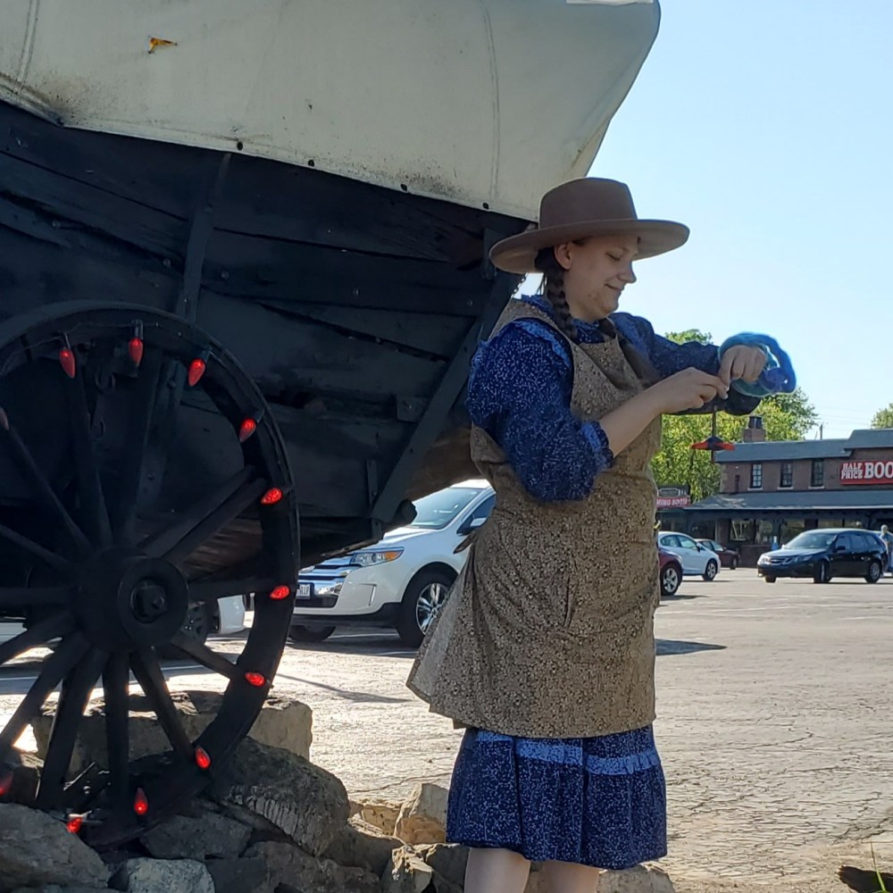 Emma spinning in her garb