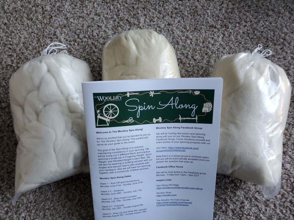 three bags of commercial top and a packet that says "Woolery Spin Along"