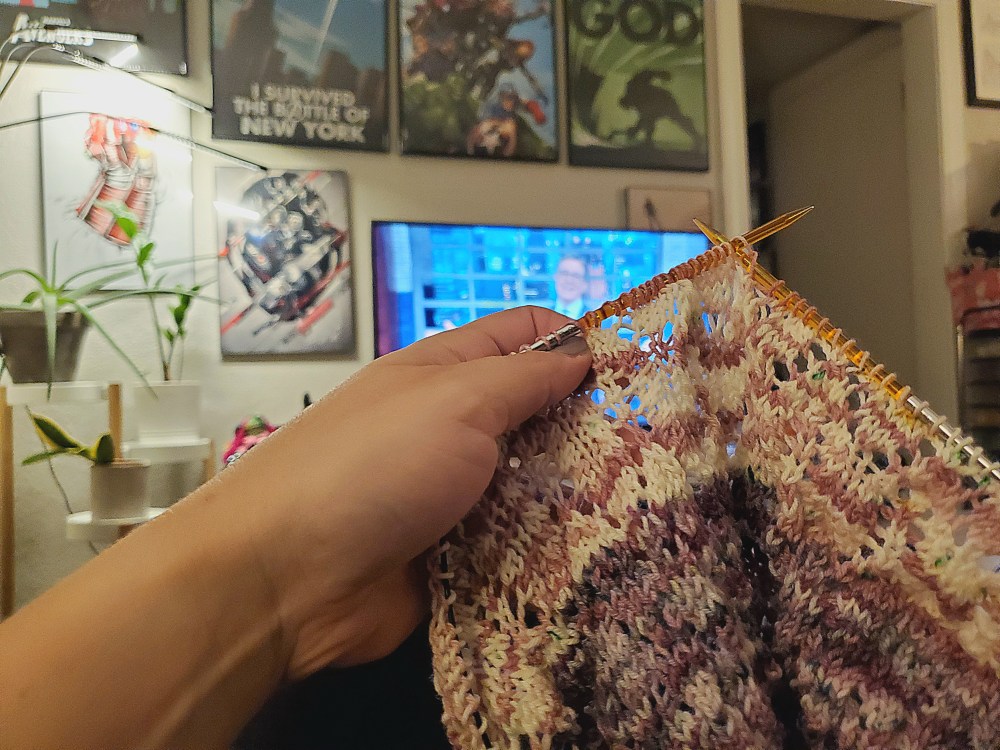 knitting project in front of a tv