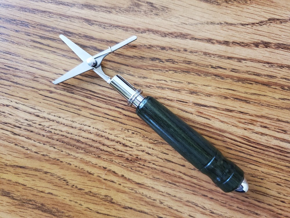 scissors in a hand-turned case