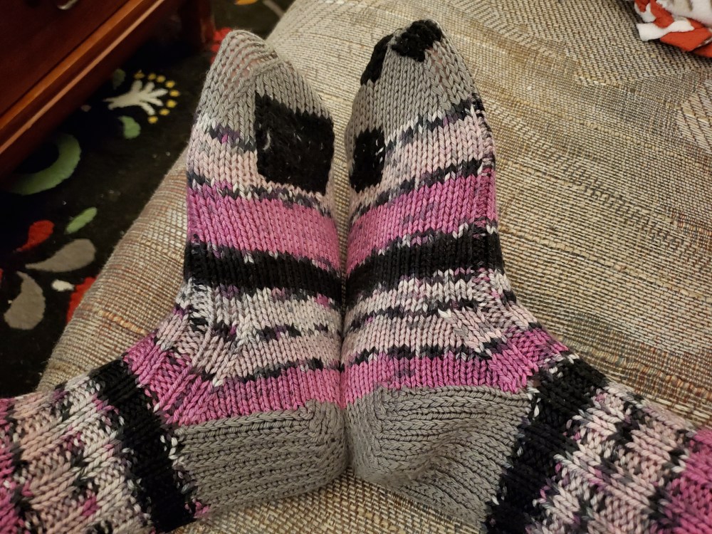 visible mending on boot socks